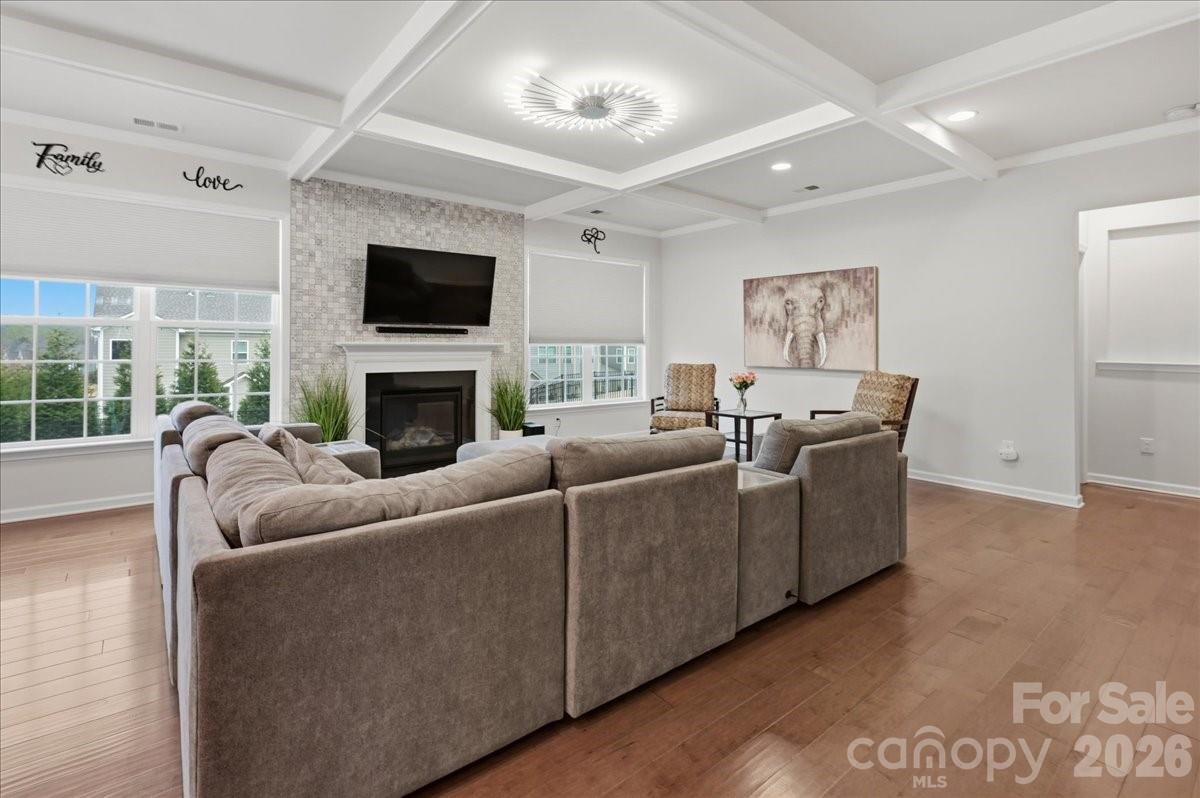 3001 Sterling Drive Waxhaw, NC 28173 - Photo 3 of 39 a living room with furniture a flat screen tv and a fireplace