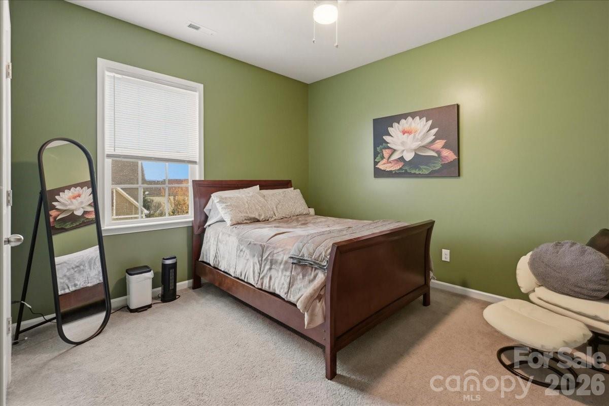 3001 Sterling Drive Waxhaw, NC 28173 - Photo 33 of 38 a bedroom with a bed and a painting on the wall