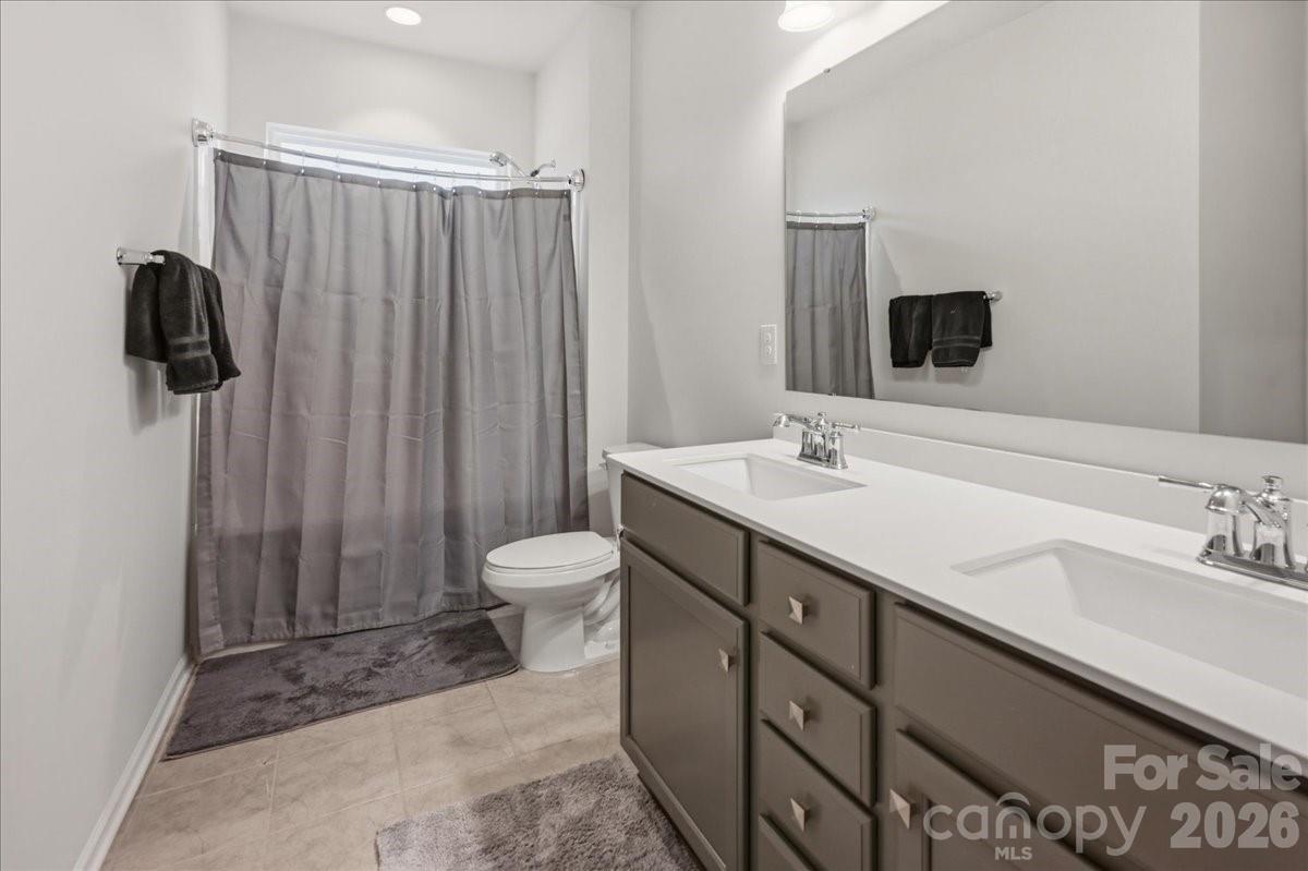 3001 Sterling Drive Waxhaw, NC 28173 - Photo 35 of 38 a bathroom with a sink a toilet and shower