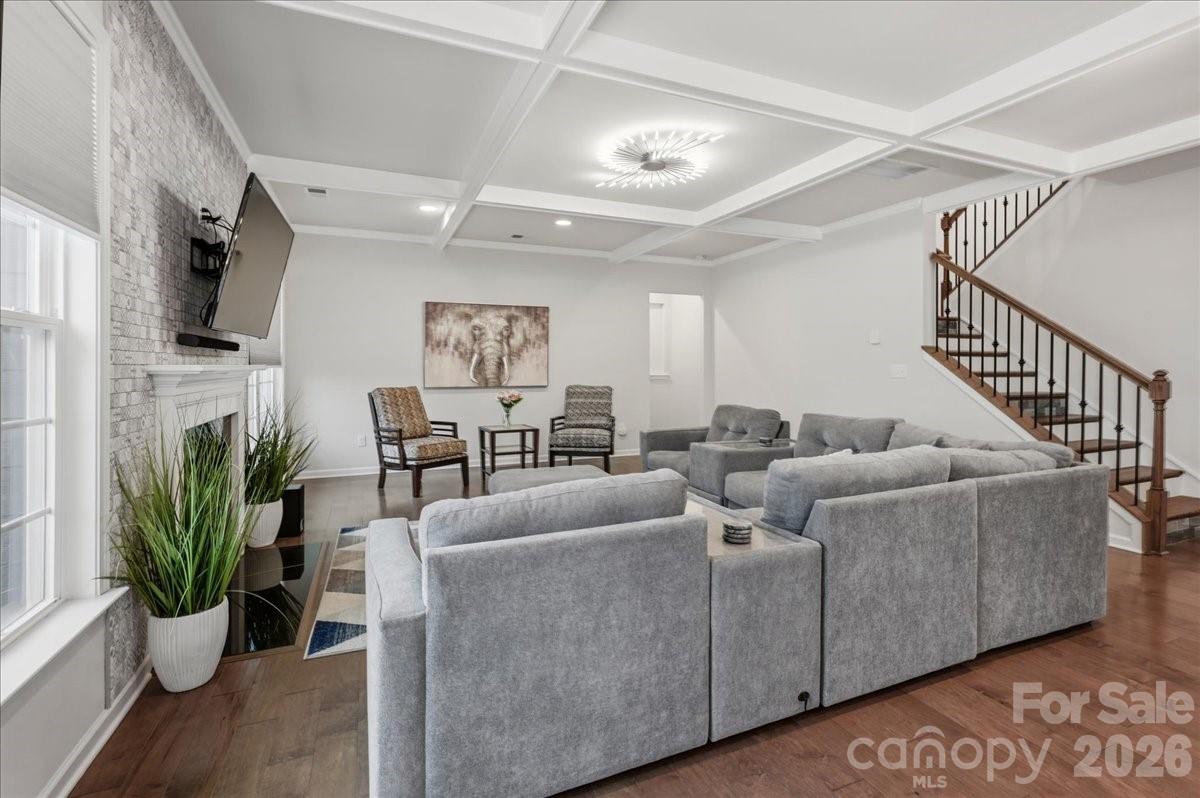 3001 Sterling Drive Waxhaw, NC 28173 - Photo 4 of 39 a living room with furniture potted plant and a flat screen tv