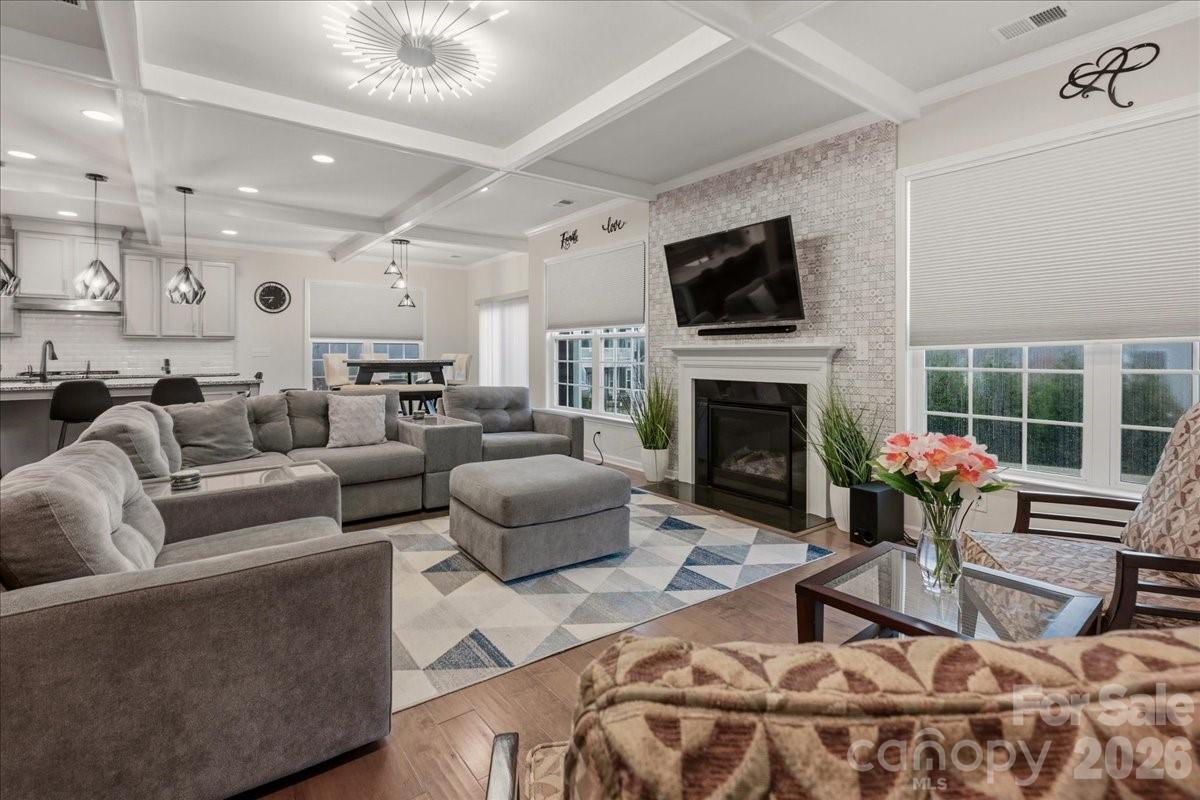 3001 Sterling Drive Waxhaw, NC 28173 - Photo 8 of 38 a living room with furniture a flat screen tv and a fireplace