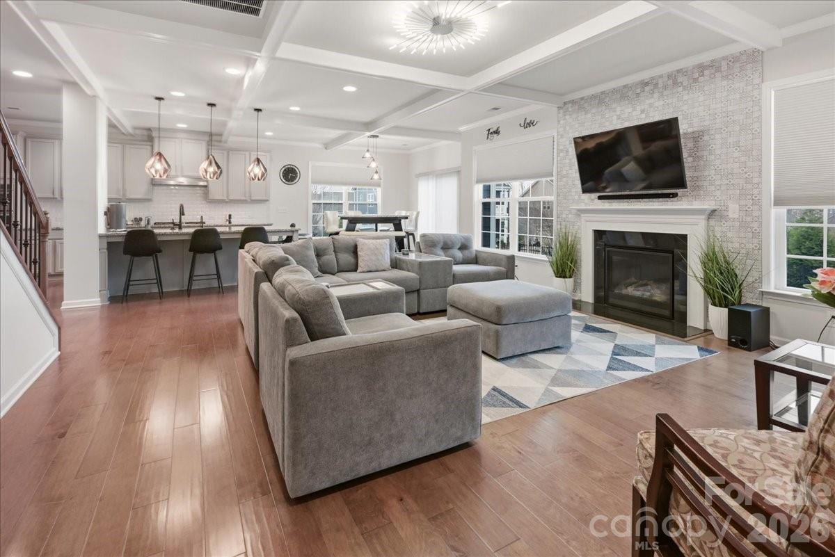 3001 Sterling Drive Waxhaw, NC 28173 - Photo 10 of 39 a living room with furniture a fireplace and a flat screen tv