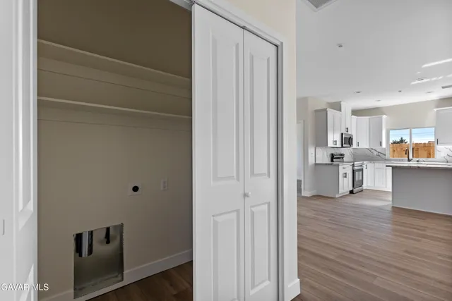 a view of a bathroom with wooden floor