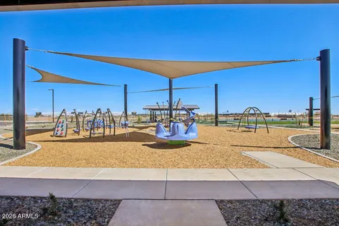 a view of a swimming pool with outdoor seating