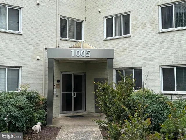 a front view of a brick building with a entrance