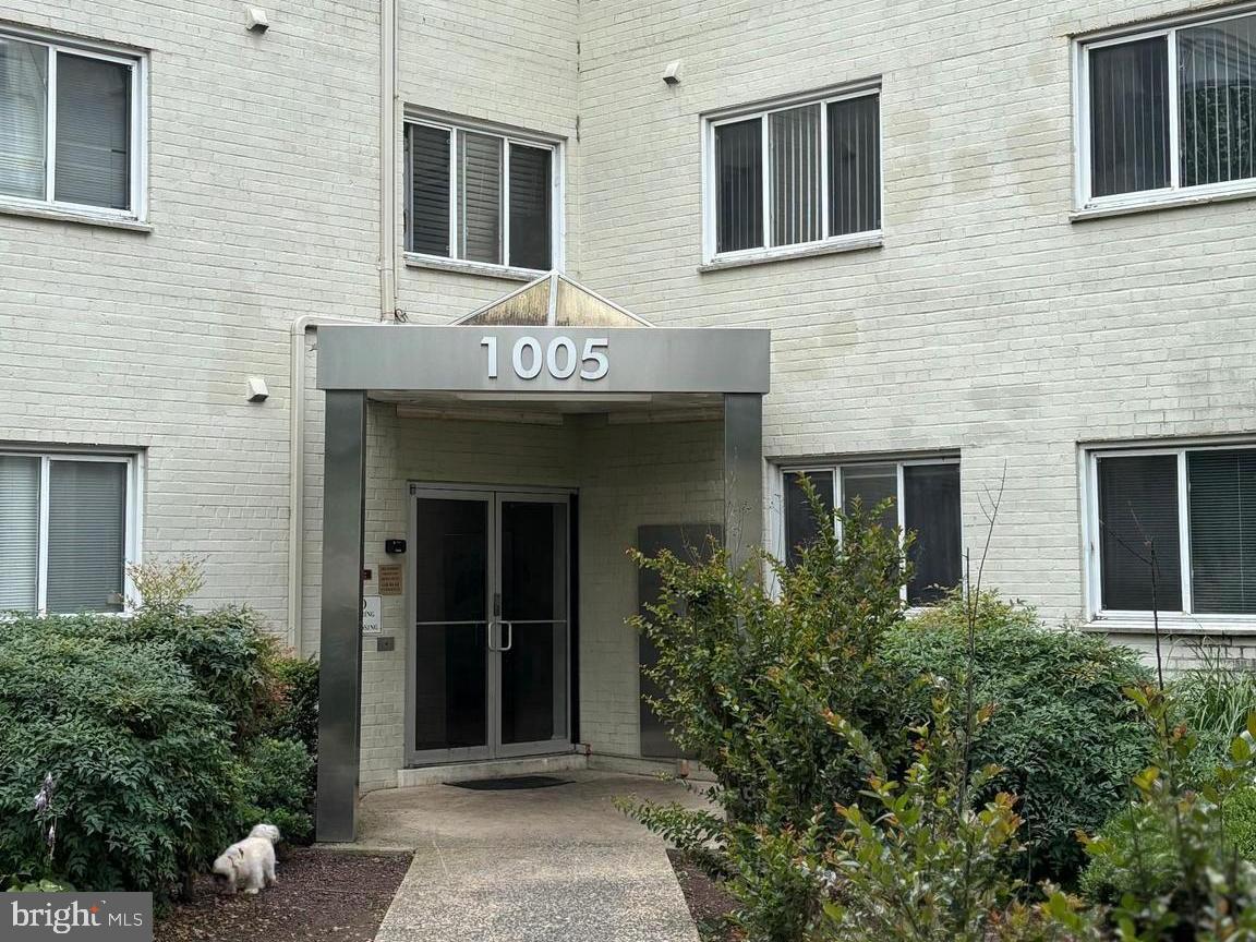 a front view of a brick building with a entrance