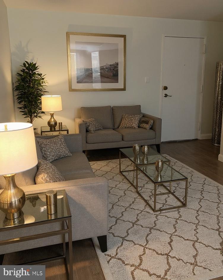 1005 Chillum Road, Unit 212 Hyattsville, MD 20782 - Photo 3 of 13 a living room with furniture and a lamp