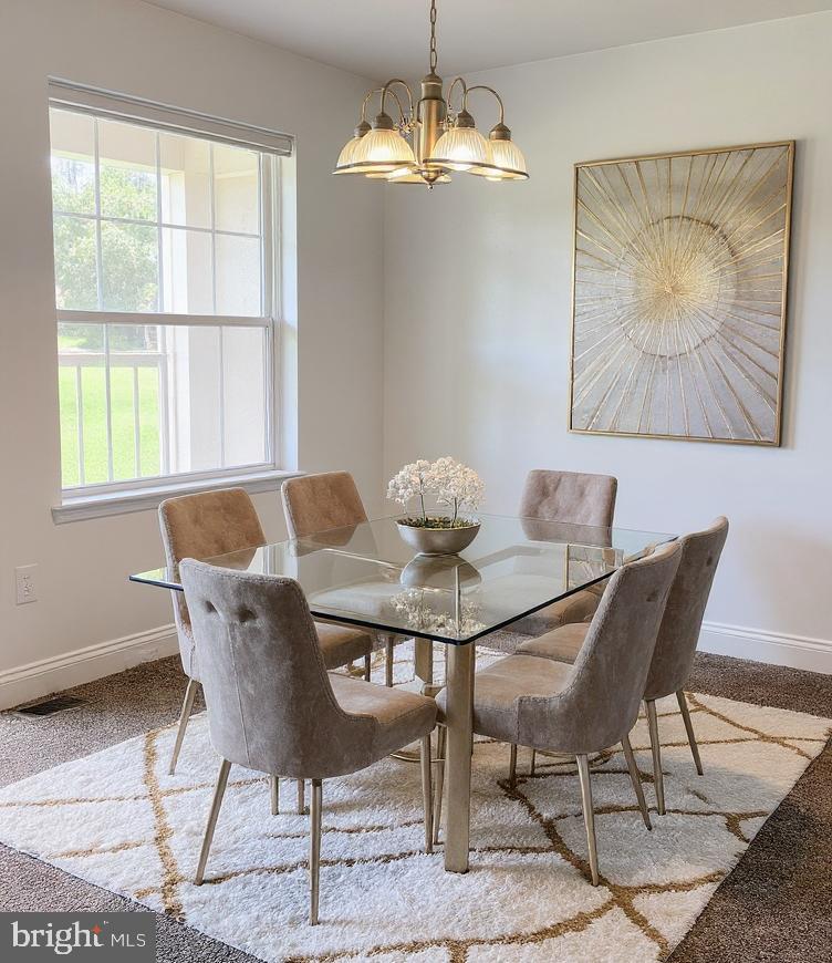 1005 Chillum Road, Unit 212 Hyattsville, MD 20782 - Photo 4 of 13 a view of a dining room with furniture window and outside view