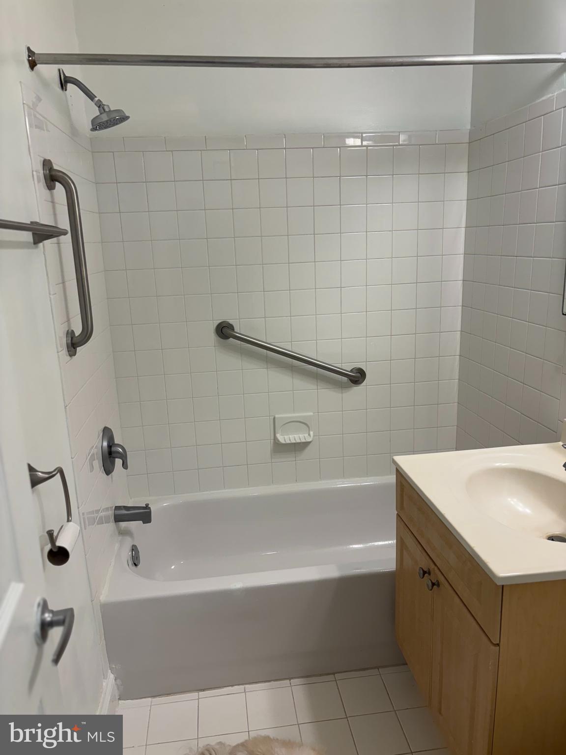 1005 Chillum Road, Unit 212 Hyattsville, MD 20782 - Photo 9 of 13 a bathroom with a bathtub a shower and a sink