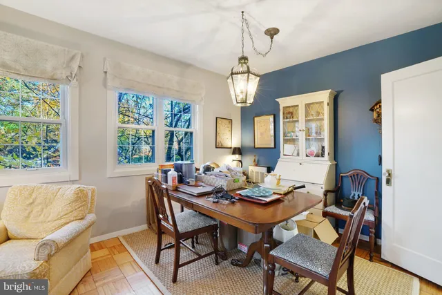 a view of a dining room with furniture window and outside view