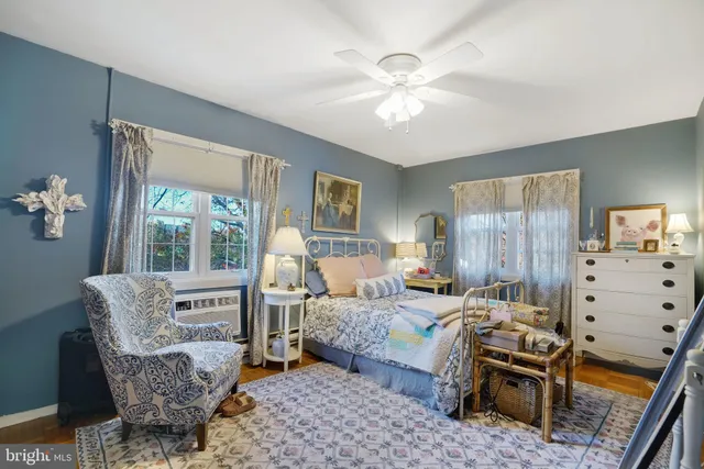 a bedroom with furniture and a window