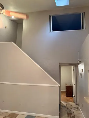 a kitchen with a refrigerator and a sink