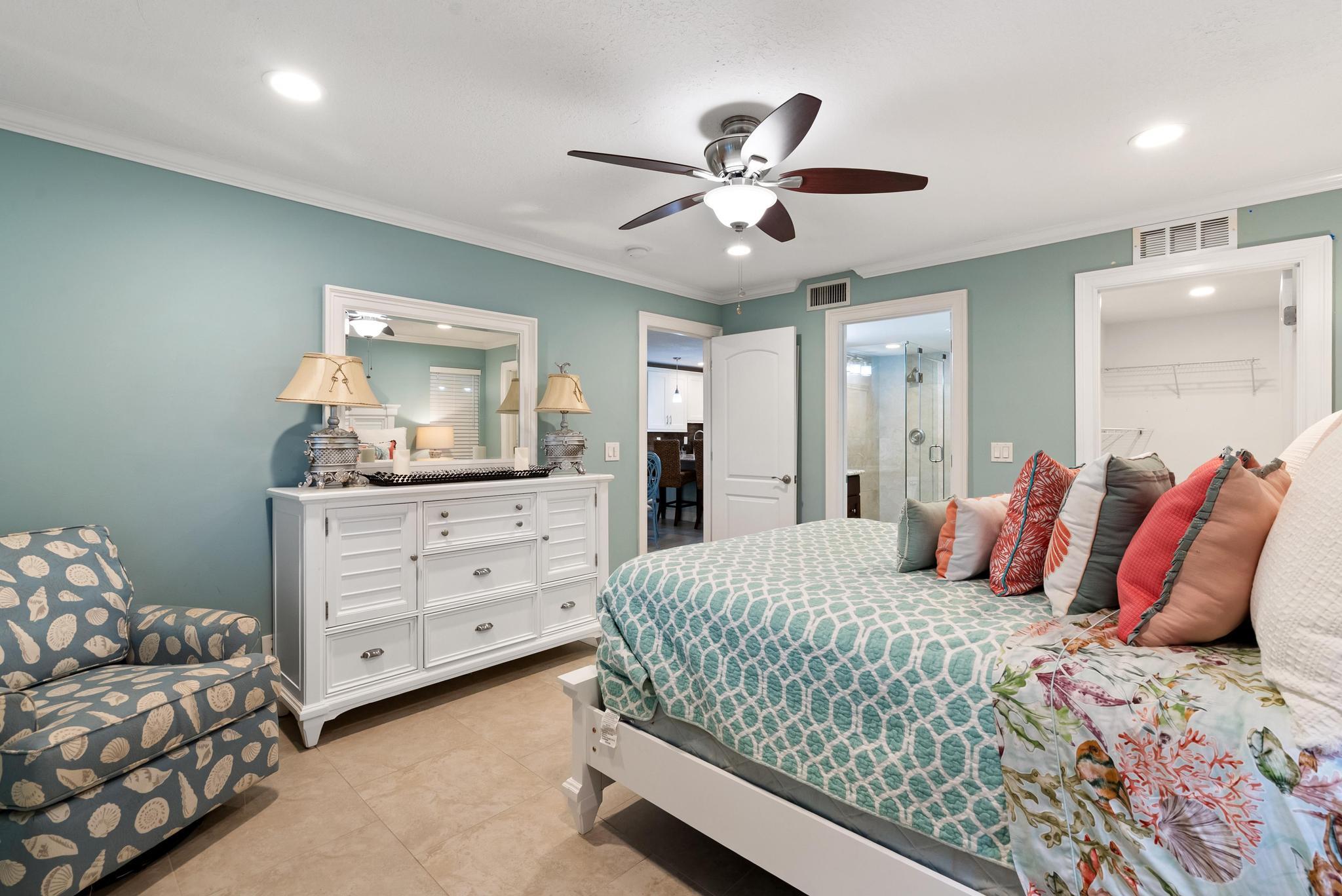 1280 Northwest 20th Avenue, Unit 101 Delray Beach, FL 33445 - Photo 19 of 31 a bedroom with a bed and a dresser