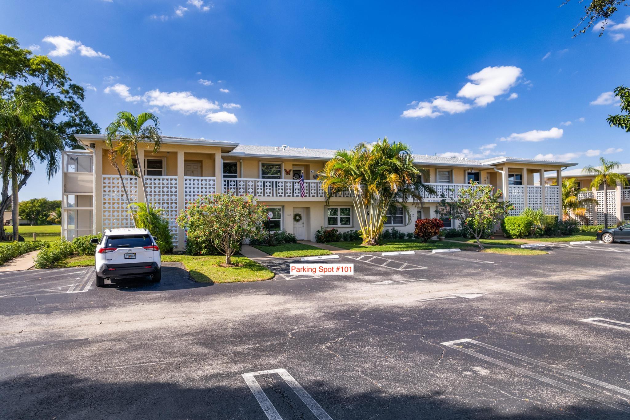 1280 Northwest 20th Avenue, Unit 101 Delray Beach, FL 33445 - Photo 29 of 31 a view of a house with swimming pool and sitting area