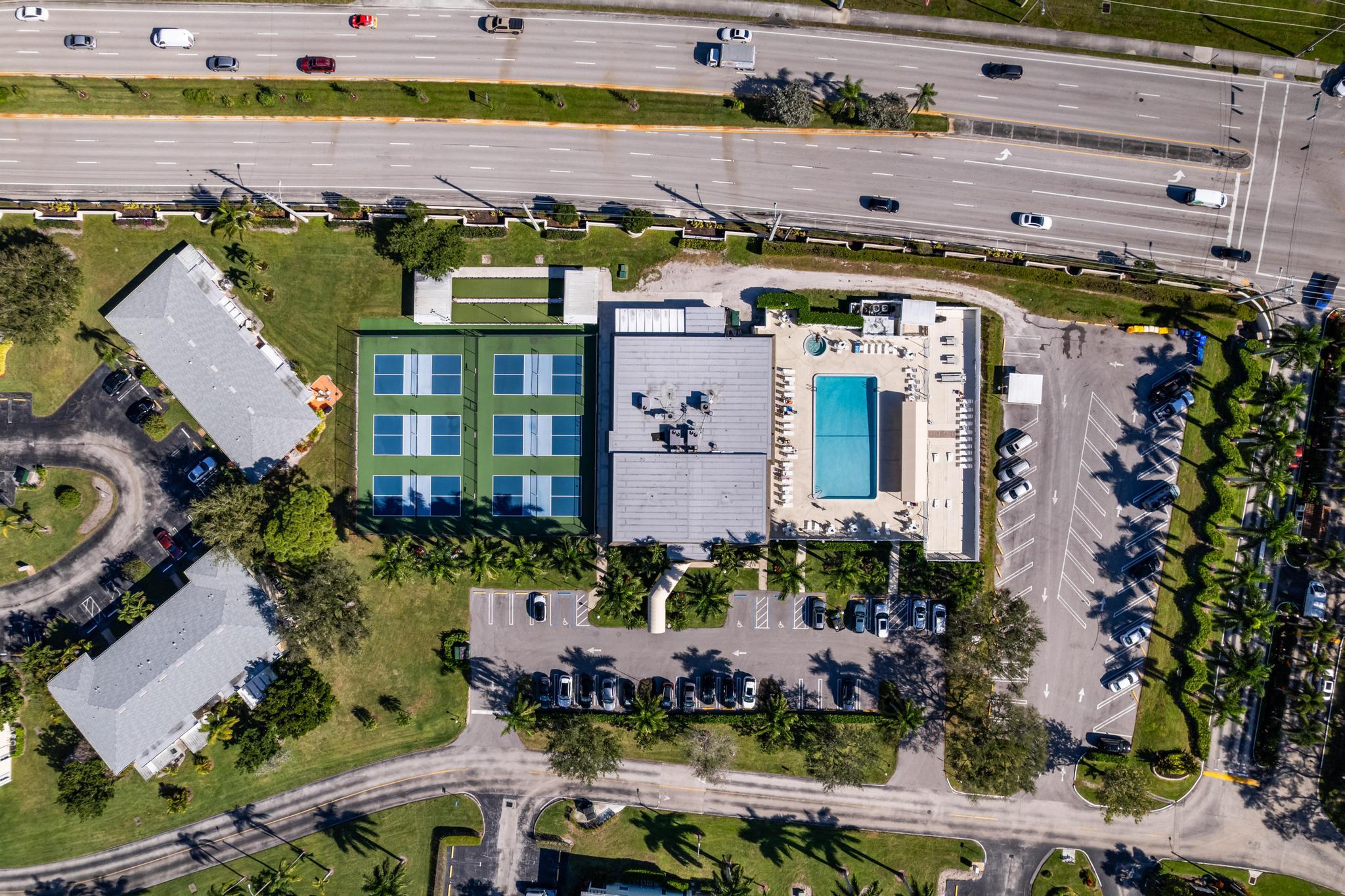 1280 Northwest 20th Avenue, Unit 101 Delray Beach, FL 33445 - Photo 31 of 31 an aerial view of a building with outdoor space