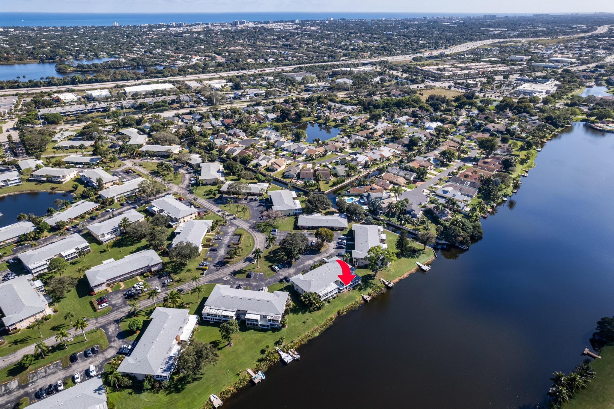 1280 Northwest 20th Avenue, Unit 101 Delray Beach, FL 33445 - Photo 4 of 31 an aerial view of a city