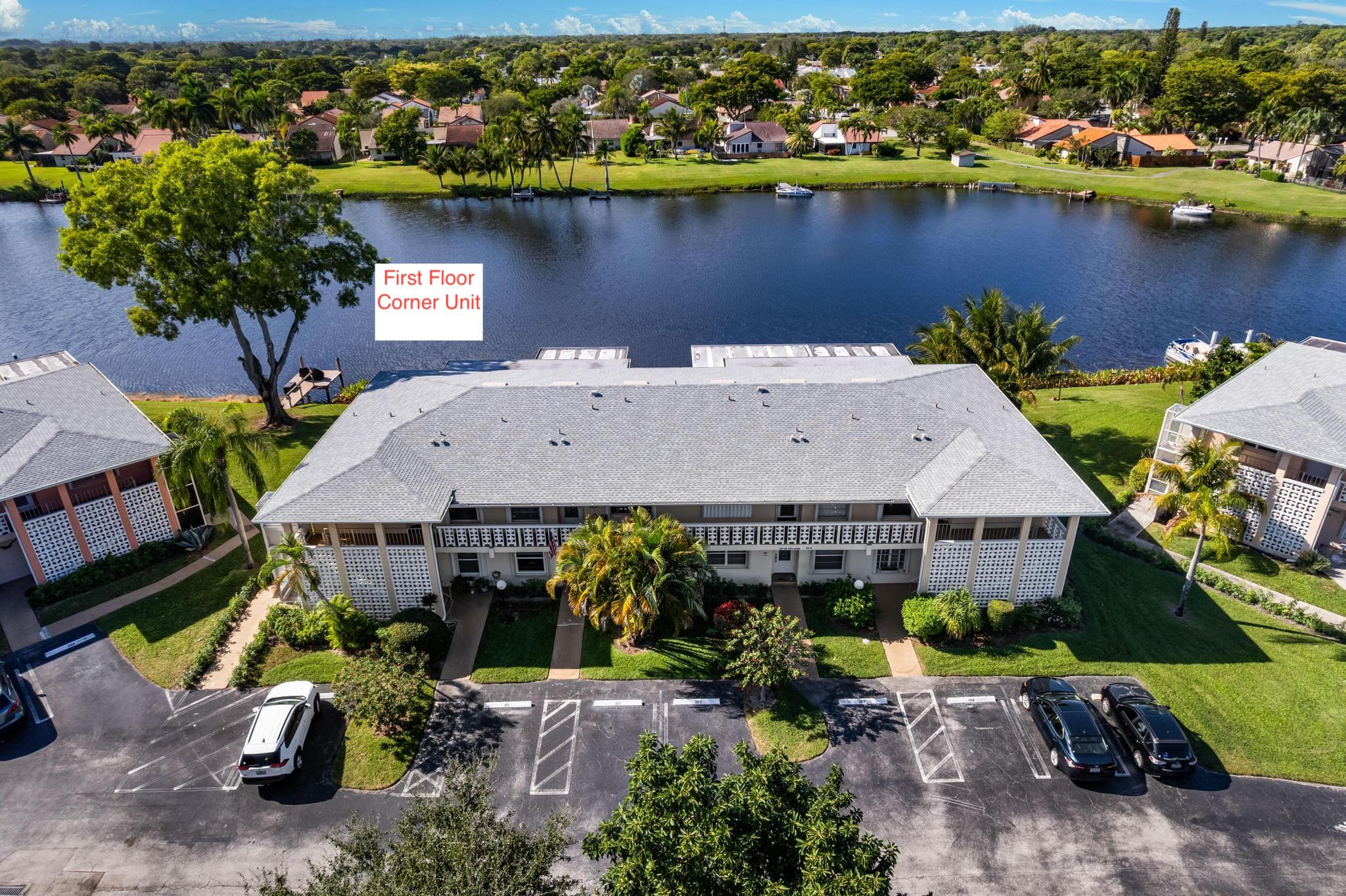 1280 Northwest 20th Avenue, Unit 101 Delray Beach, FL 33445 - Photo 5 of 31 an aerial view of a house with a lake view