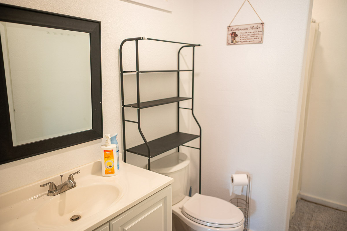 681 Lot 2-b Hoaka Road Hilo, HI 96720 - Photo 24 of 30 a bathroom with a sink a toilet and mirror