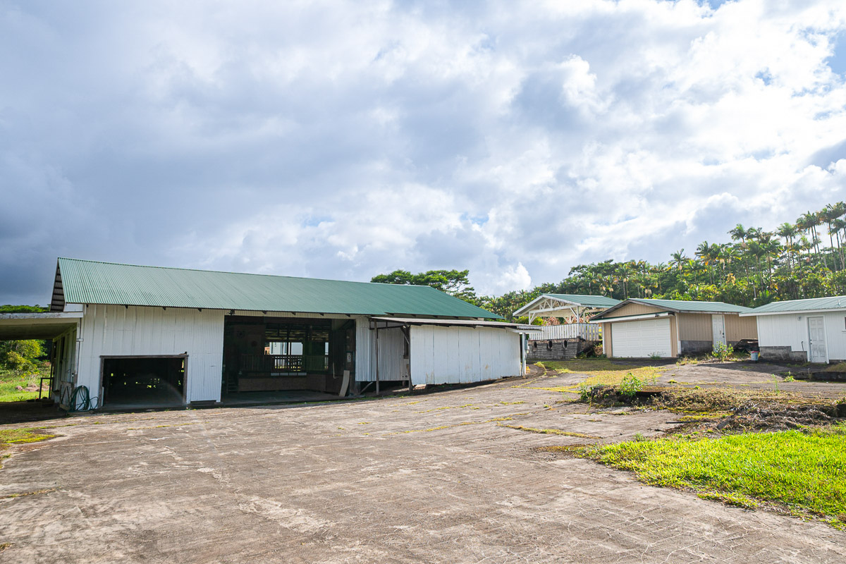 681 Lot 2-b Hoaka Road Hilo, HI 96720 - Photo 6 of 30 a front view of a house with a yard and garage