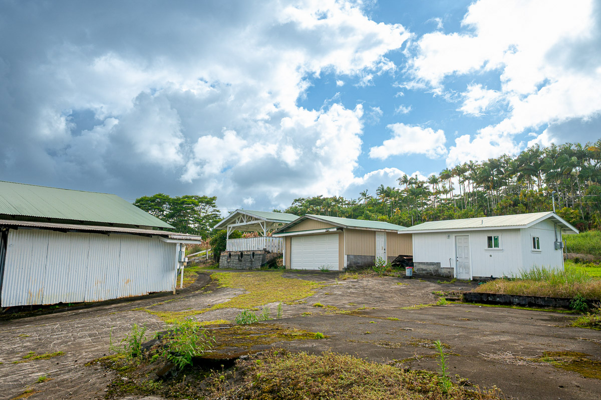 681 Lot 2-b Hoaka Road Hilo, HI 96720 - Photo 9 of 30 a view of a yard with plants and brick wall