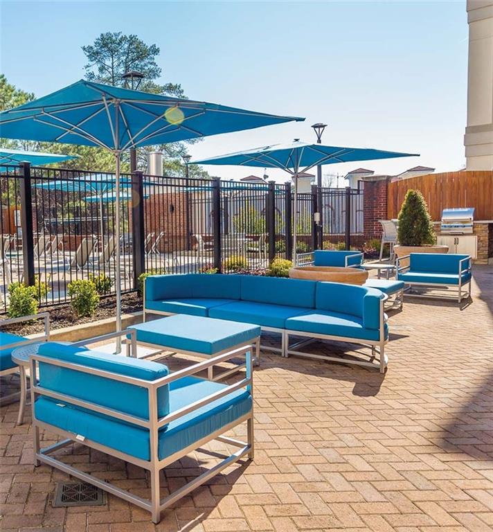 3645 Habersham Road Northeast, Unit 3B3BA Atlanta, GA 30305 - Photo 14 of 16 a outdoor space with pool table and chairs