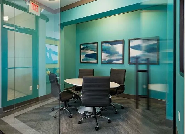 a workspace with furniture and a window