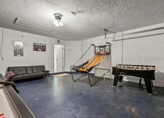 a living room with a table and a potted plant