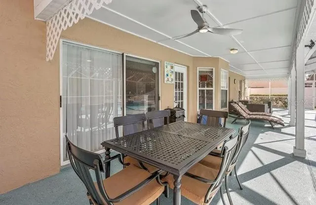 a view of a dining room with furniture window and outside view