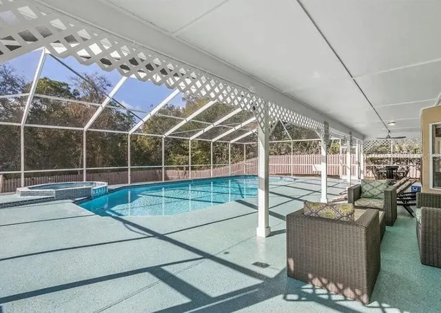a view of a patio with couches chairs and potted plants