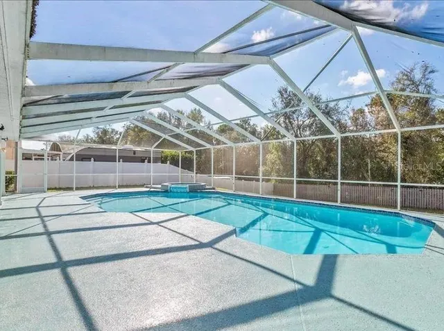 a view of a swimming pool with an outdoor space