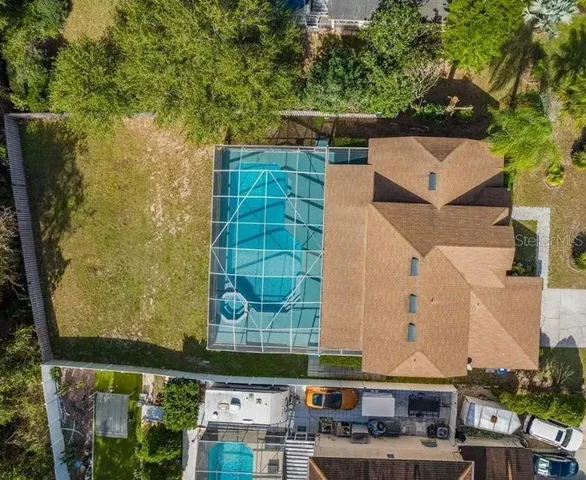 an aerial view of a house with a swimming pool