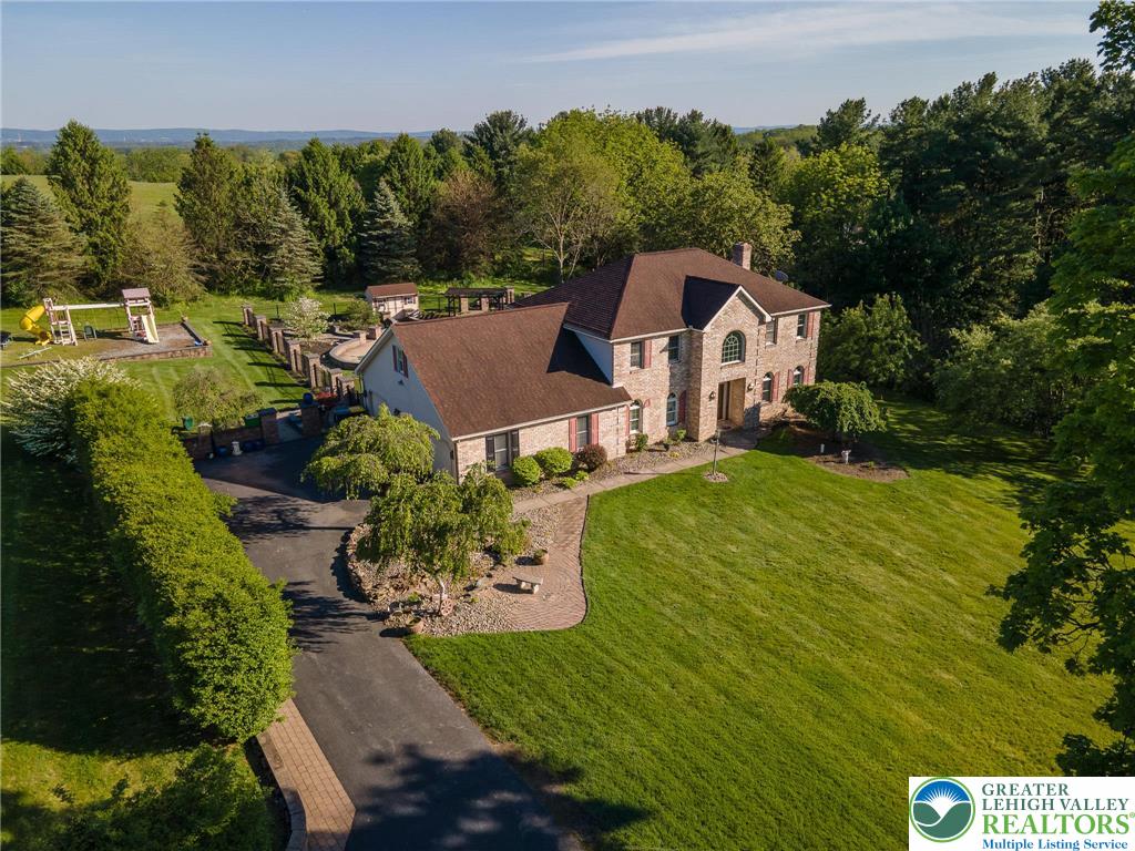 2170 Clearview Road Coplay, PA 18037 - Photo 3 of 75 This spacious property features a classic brick and siding exterior, offering comfort and abundant outdoor space.