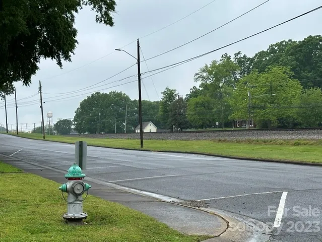 a view of a green field with lots of bushes