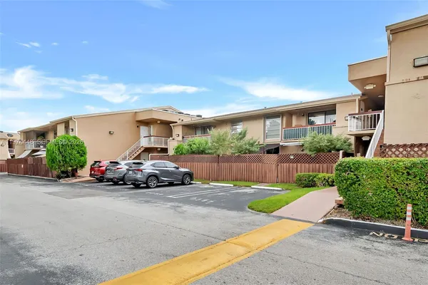 a view of a car parked in front of a house