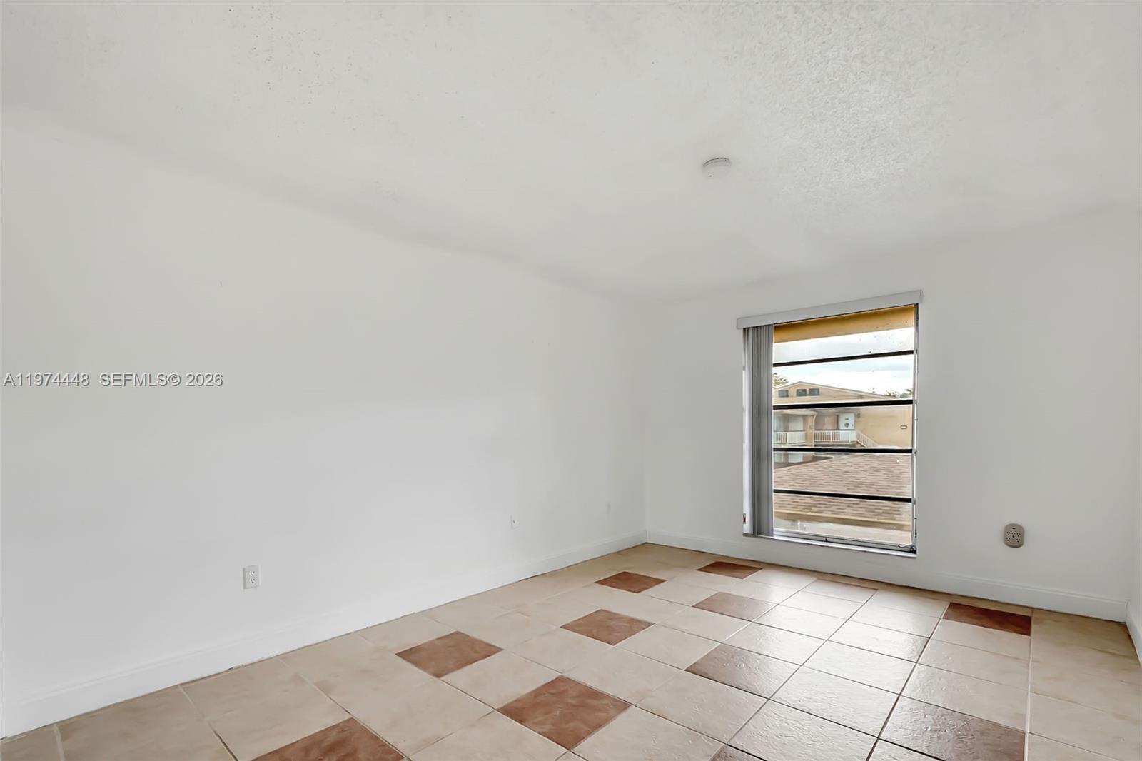 13787 Southwest 66th Street, Unit 254D Miami, FL 33183 - Photo 14 of 15 a view of a room that has a bed in it