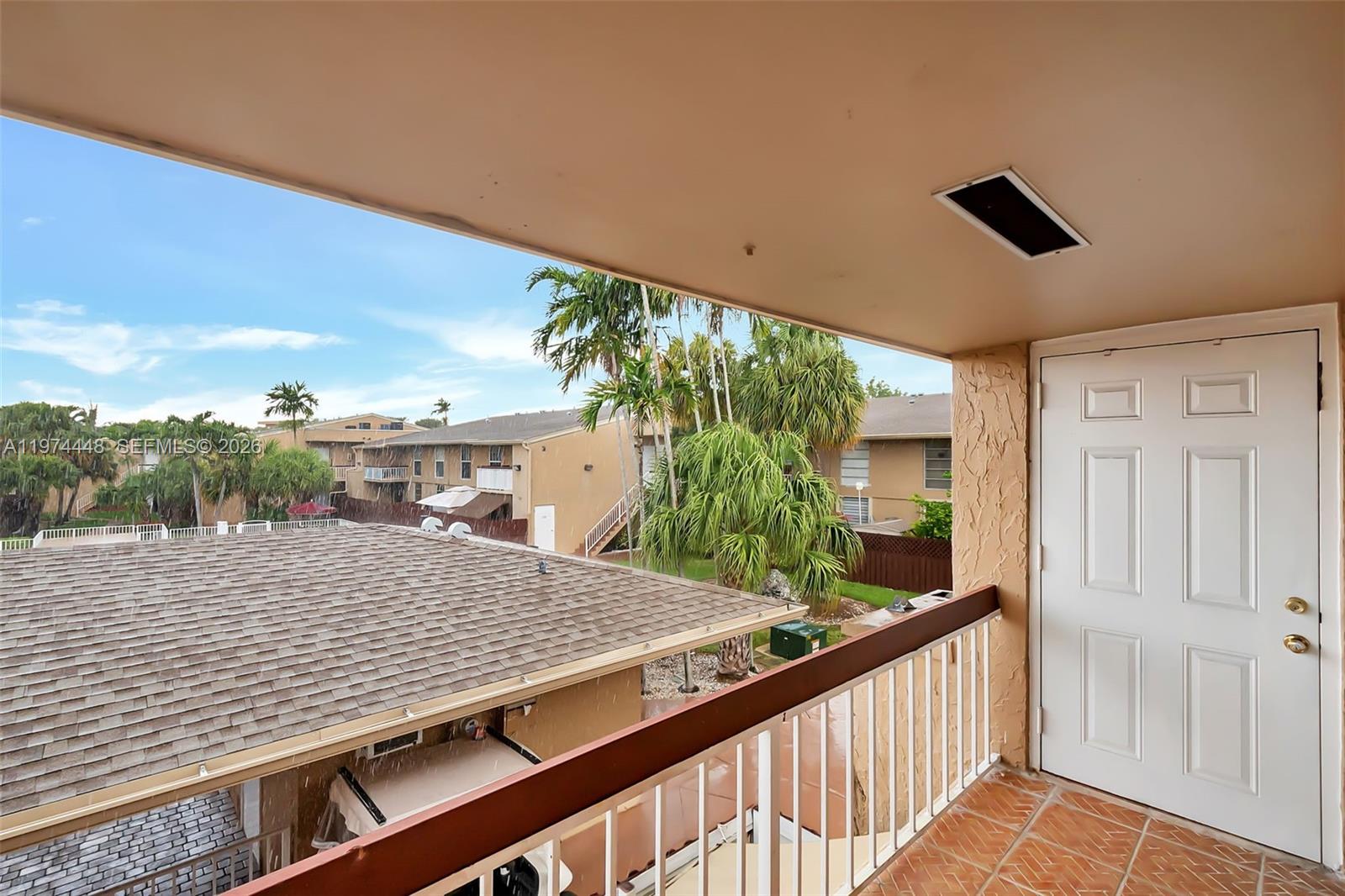 13787 Southwest 66th Street, Unit 254D Miami, FL 33183 - Photo 17 of 18 a view of a balcony and floor to ceiling windows