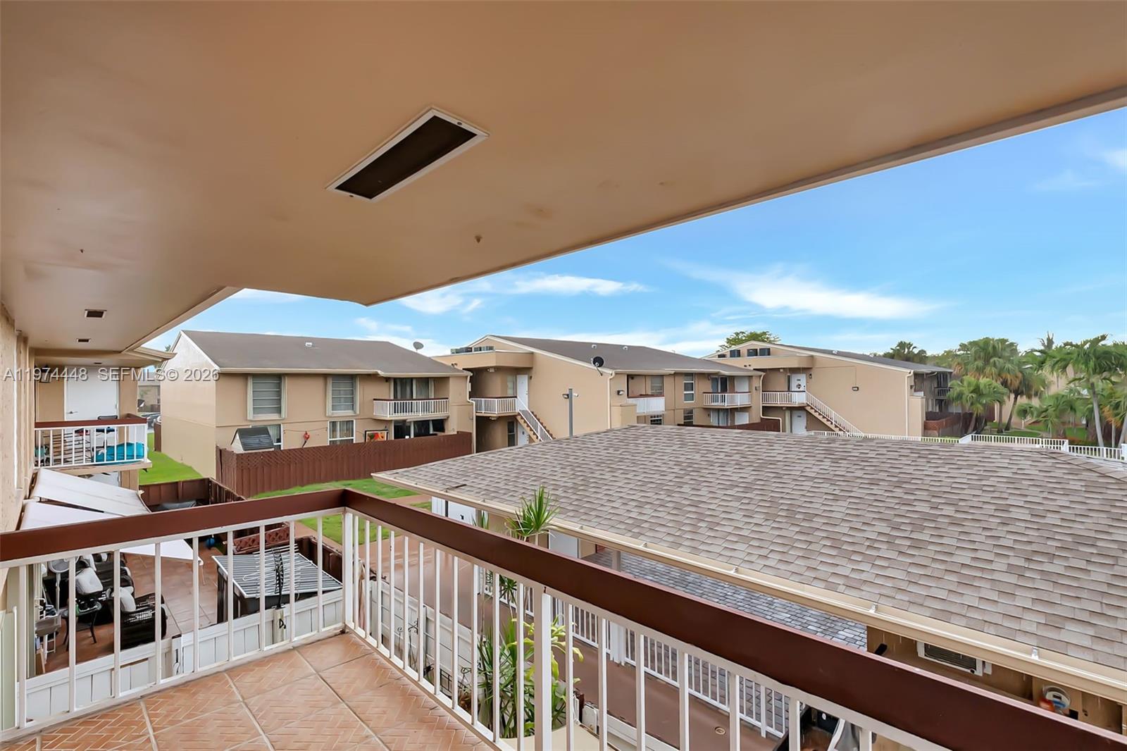 13787 Southwest 66th Street, Unit 254D Miami, FL 33183 - Photo 18 of 18 a view of a house with a patio