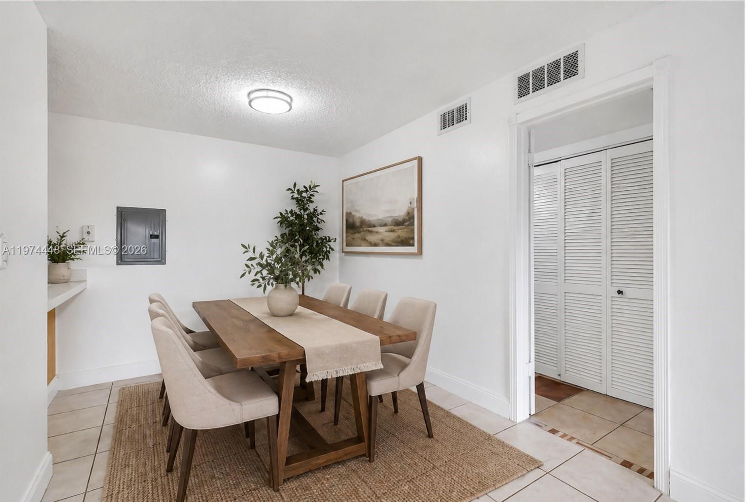 13787 Southwest 66th Street, Unit 254D Miami, FL 33183 - Photo 5 of 18 a view of a dining room with furniture