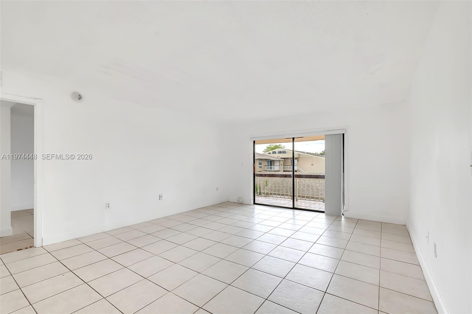13787 Southwest 66th Street, Unit 254D Miami, FL 33183 - Photo 6 of 15 an empty room with windows