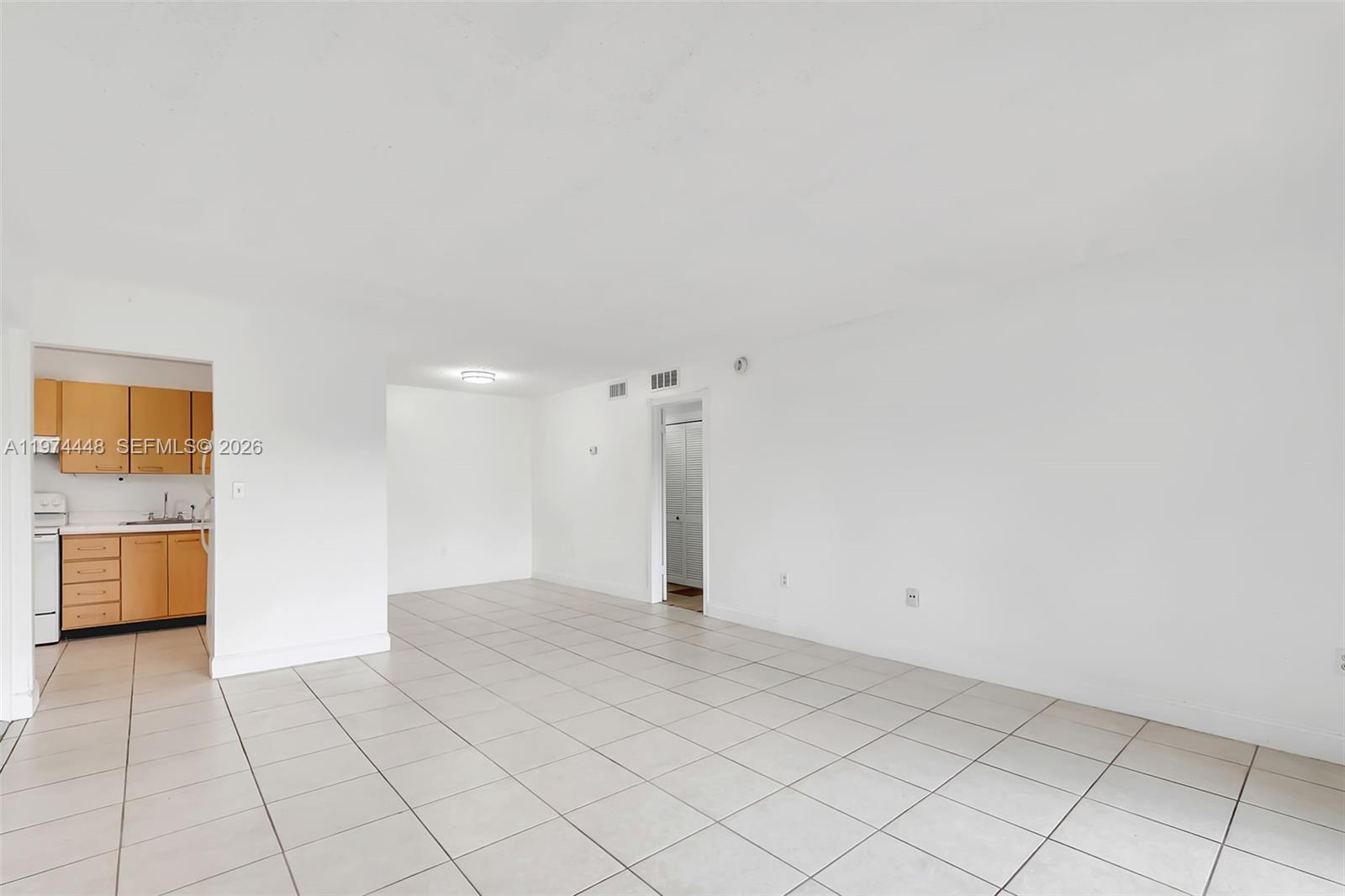 13787 Southwest 66th Street, Unit 254D Miami, FL 33183 - Photo 7 of 18 a view of an empty room and a window