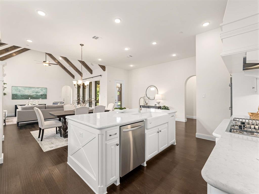 910 Marie Drive Allen, TX 75013 - Photo 13 of 38 a large white kitchen with a large window