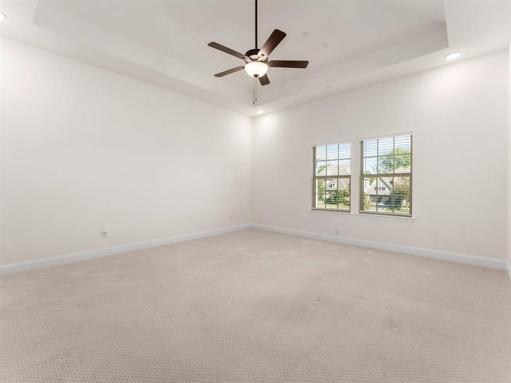 910 Marie Drive Allen, TX 75013 - Photo 24 of 38 an empty room with windows and ceiling fan