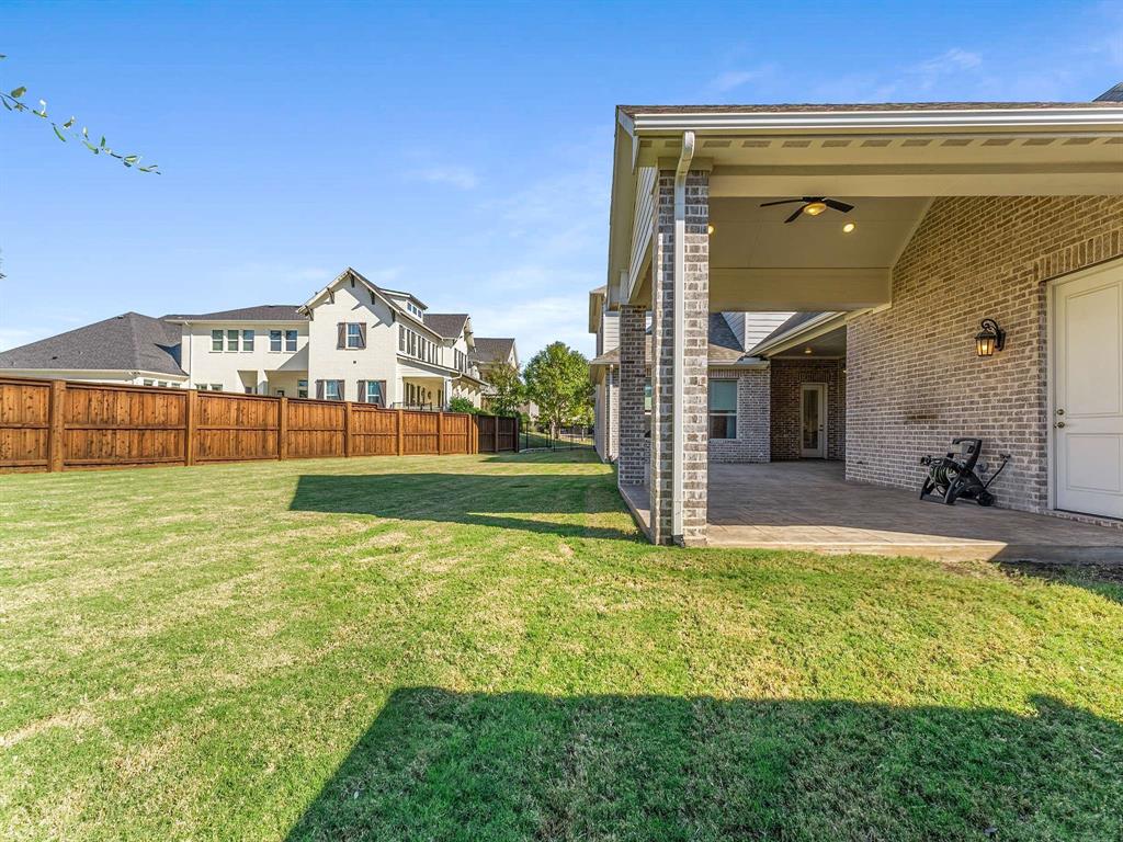910 Marie Drive Allen, TX 75013 - Photo 34 of 38 a view of a house with a yard