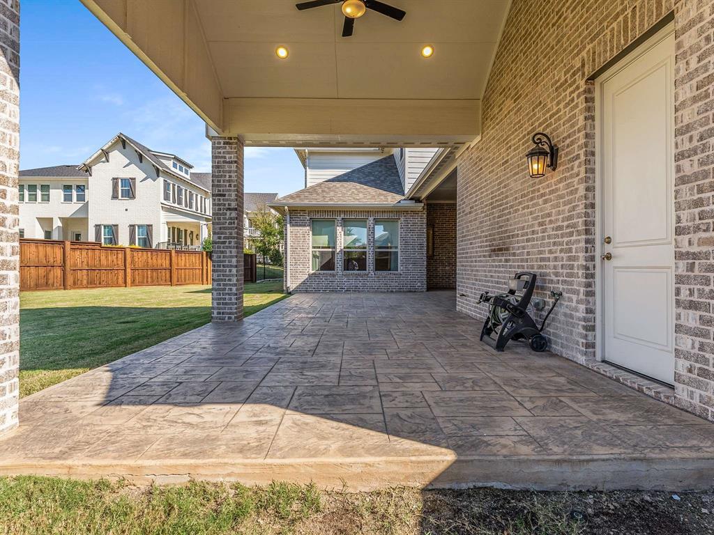 910 Marie Drive Allen, TX 75013 - Photo 36 of 38 a view of a house with a patio