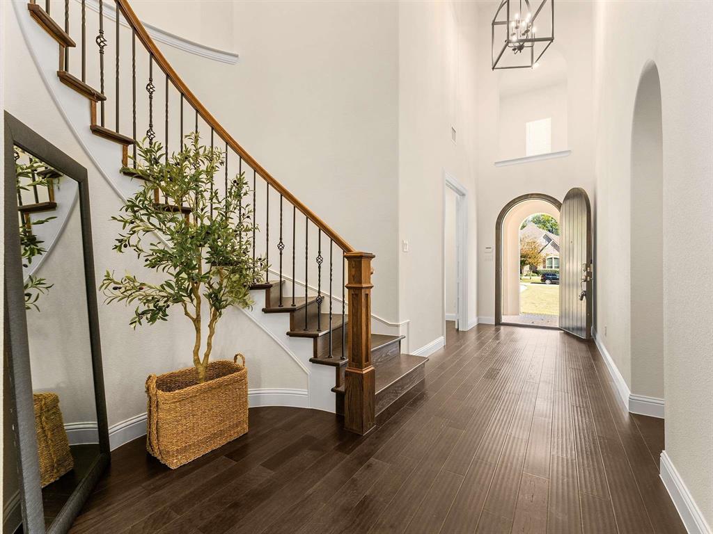 910 Marie Drive Allen, TX 75013 - Photo 7 of 38 a view of an entryway with wooden floor