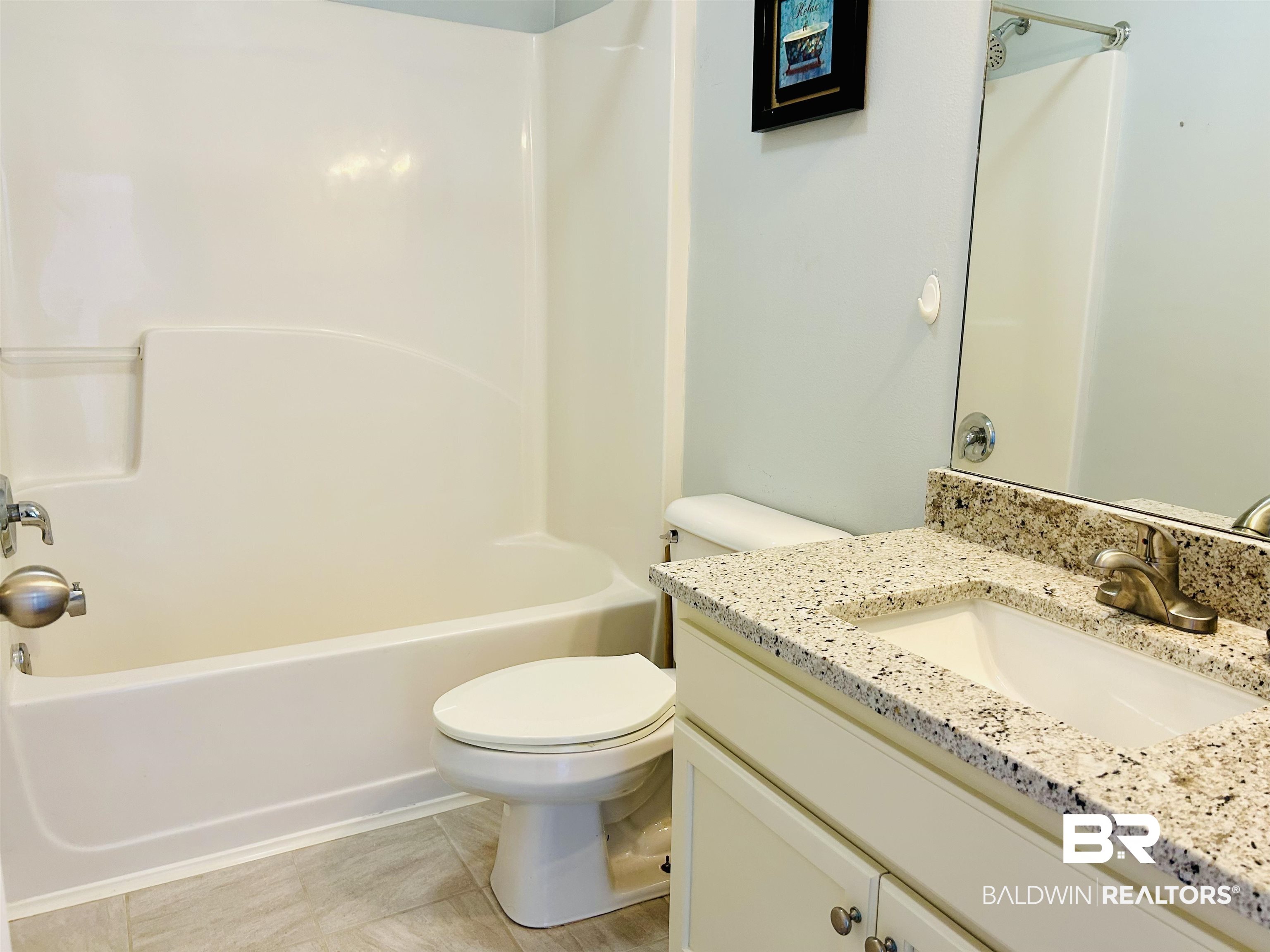 919 Parliament Court Mobile, AL 36695 - Photo 14 of 19 Full bathroom featuring shower / tub combination, vanity, and toilet