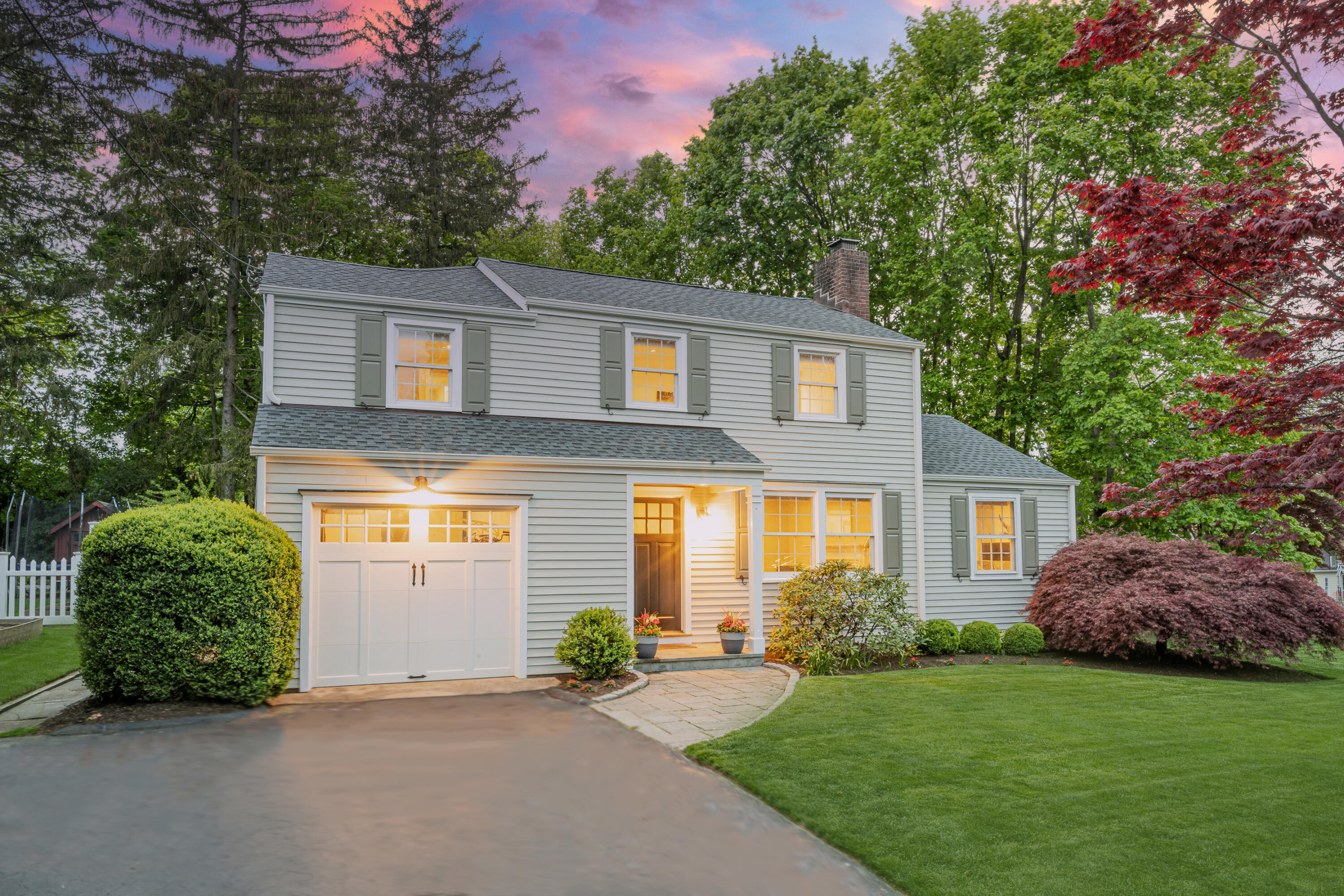 35 Miles Road Darien, CT 06820 - Photo 1 of 29 a front view of a house with a garden and plants