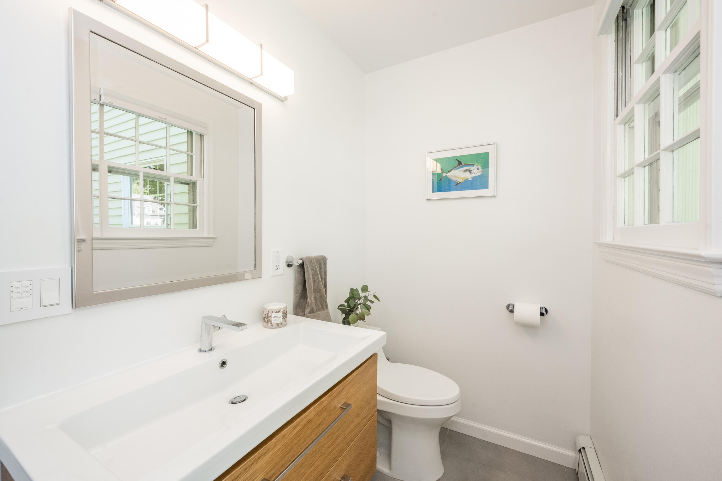 35 Miles Road Darien, CT 06820 - Photo 14 of 29 a white toilet sitting next to a bathroom sink