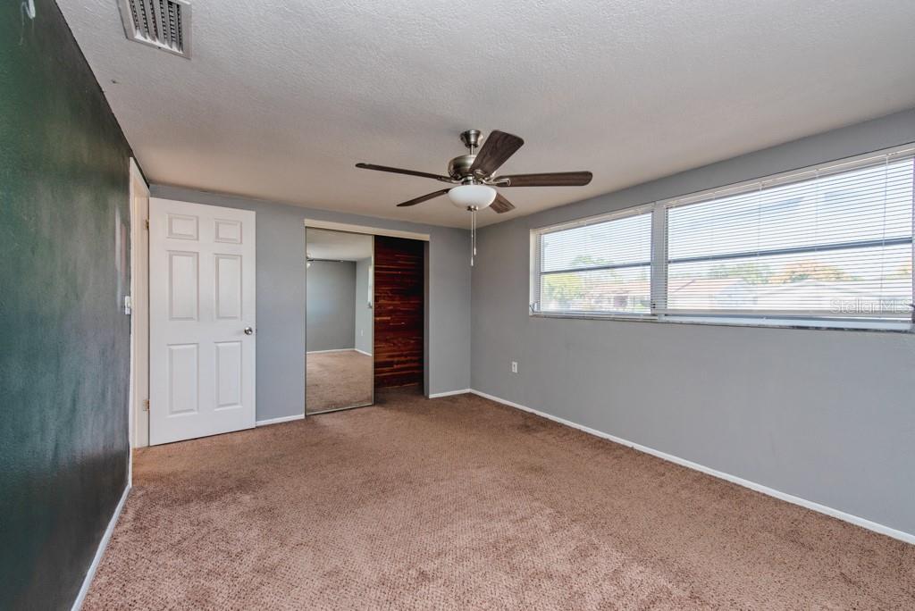 5117 School Road New Port Richey, FL 34653 - Photo 15 of 24 a view of an empty room with a window