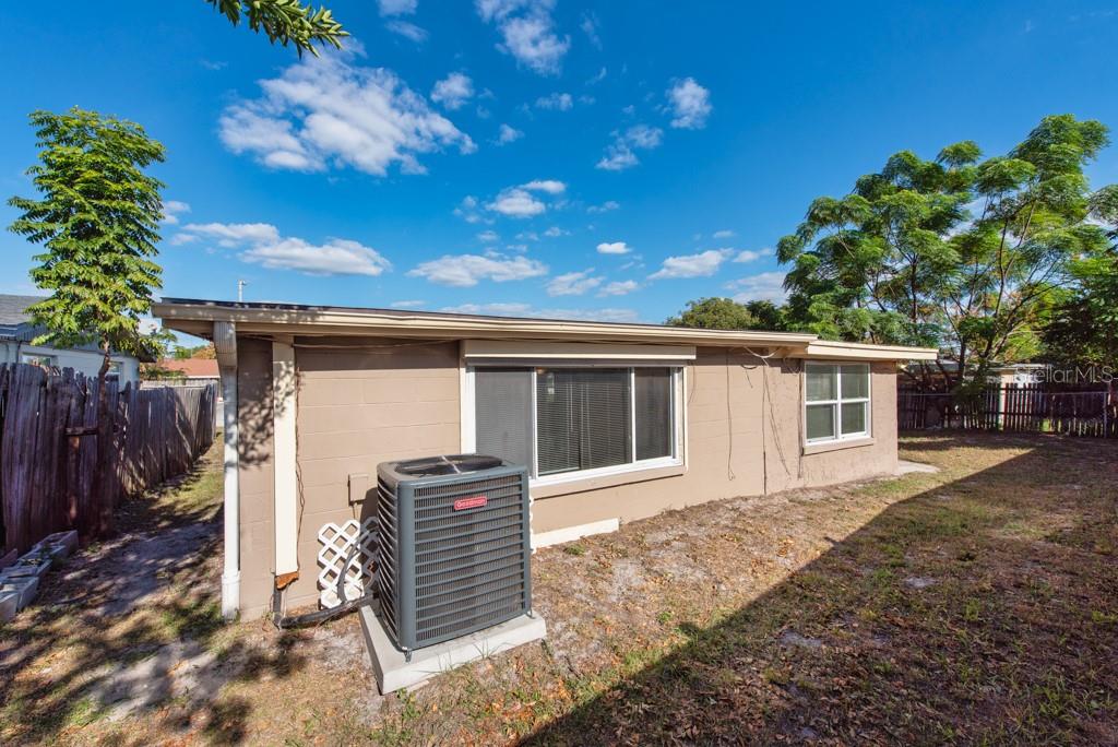 5117 School Road New Port Richey, FL 34653 - Photo 21 of 24 a front view of house with yard outdoor seating and barbeque oven